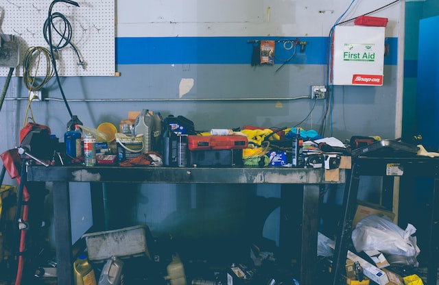 assorted-color handheld tools on work bench