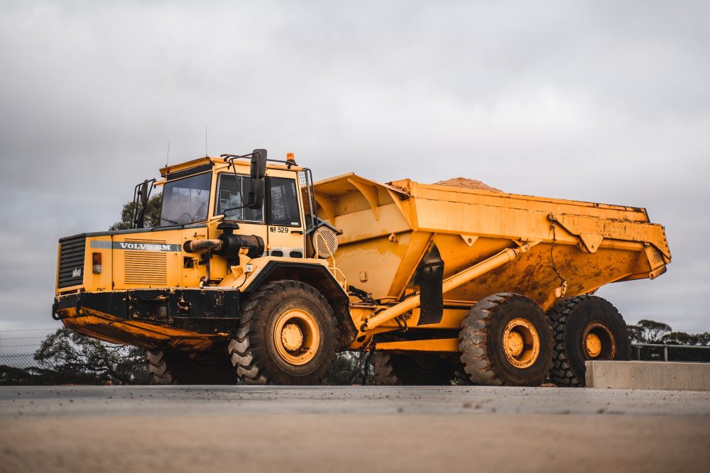 yellow and black heavy equipment on field